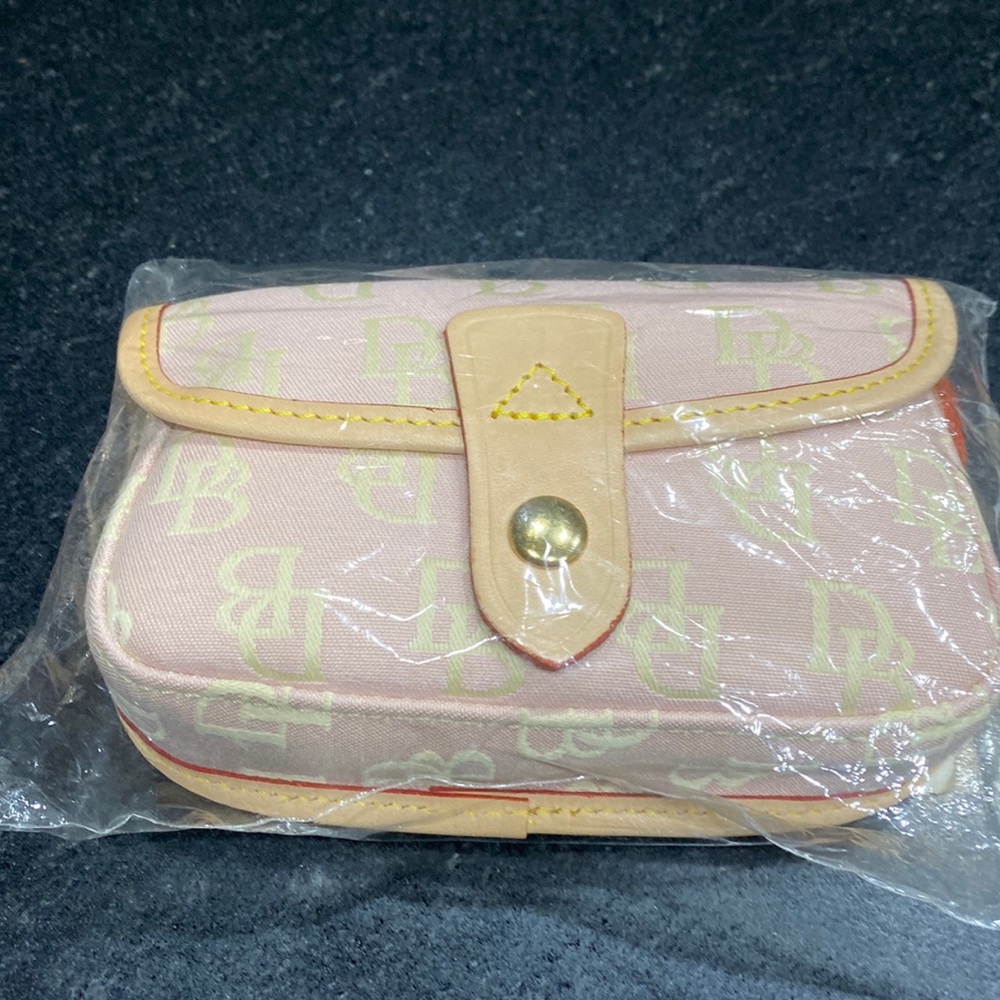 Pale pink Dooney & Burke wristlet